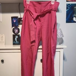 Pink ankle pants with belt tie.